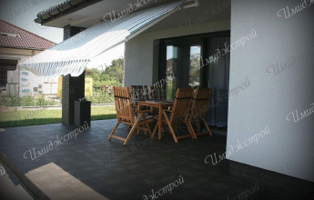 Одноэтажный дом с гаражом в стиле минимализма Одноэтажный коттедж в стиле минимализма